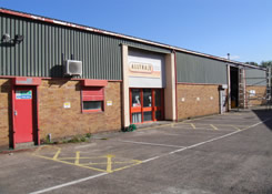 Side elevation of Industrial unit previously coated with a Plastisol paint system. Weston Painting Contractors of Cardiff brush coated the complete external of the building with an anti fungicidal solution prior to the power washing of all sub-straights to obtain maximum substrate adhesion.